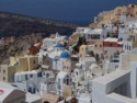 Blue domes amongst the buildings of Oia